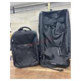 2 black carry one suitcases
