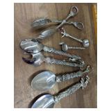 Flat of serving spoons and tongs