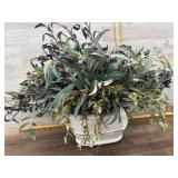 White flower pot with greenery plant