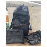 Large black rolling duffle style bag and 2