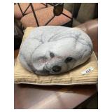 Painted dog rock on pillow