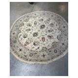 70 round tan and brown area rug