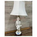 Flute player lamp with white shade
