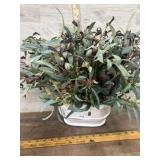 Artificial floral in white pot