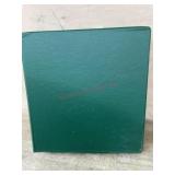 Green binder of postage stamps