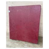Red binder of Canada commemorative stamps