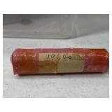 Roll of pennies labeled 1960s. We did not open to