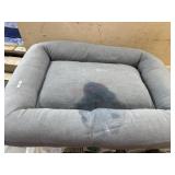 Open box large dog bed. Has detergent spilled on