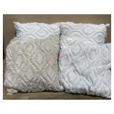 Box of white and cream throw pillows