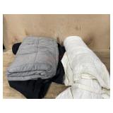 Box with cream comforter and weighted blanket