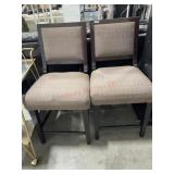 2- Tan upholstered bar chairs.   (damaged seat on