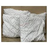Box of white throw pillows