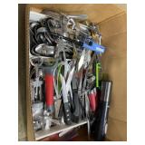 Box of kitchen gadgets and utensils and flatware