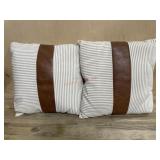 2- Tan and white throw pillows