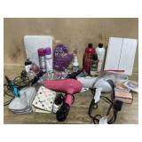 Box of bathroom accessories and hair dryers.