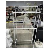 White metal over the toilet stand