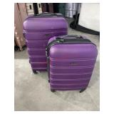 2 piece Purple Rockland hard shell suitcase. Bad