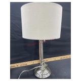 Brushed finish table lamp with tan shade