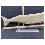Large folk art wood carving of whale on a stand