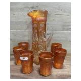 Marigold carnival glass pitcher with 6 glasses