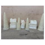 Lighted white houses and trees