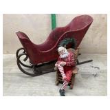 Wood sleigh and Santa figure