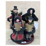 Carolers on wood base with candlestick lantern