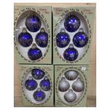 4 Boxes of purple glass ornaments