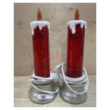 Pair of Red lighted Christmas candles