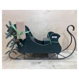 Green wooden sleigh with metal runners