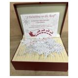 Box of Thomas Clark metal snowflake ornaments