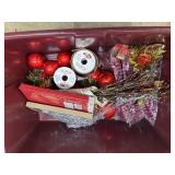 Tote of red ornaments and tree decorations