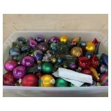 Tote of multi color ornaments and garland