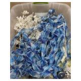 Tote of blue and turquois ornaments and picks