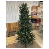 6 foot   Christmas tree prelit. Electric in pole