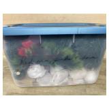 Tote of lighted garlands and some ball ornaments