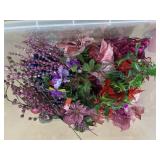 Tote of pink and blue ornaments and floral picks