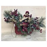 Red metal sleigh with florals