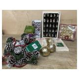 Box lot with pine cone garland/ bells/ and misc.