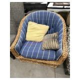 Wicker chair with blue plaid cushions