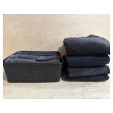 Set of black bath towels in basket   4 bath 4