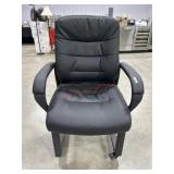 Rolling black faux leather office chair