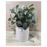 Small white pot with artificial pothos plant