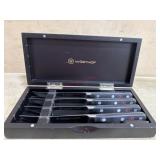 4 Wusthof black handle steak knives in wood case