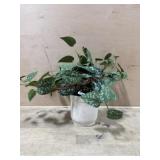 Artificial pothos plant in white pot