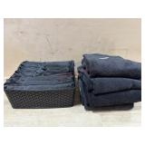 Set of black bath towels in basket   4 bath 4