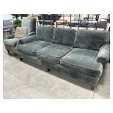 Green chenille style fabric sofa with matching