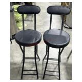 2- Black folding stools with backs