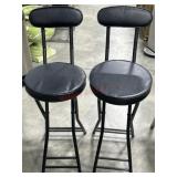 2- Black folding stools with backs