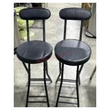 2- Black folding stools with backs